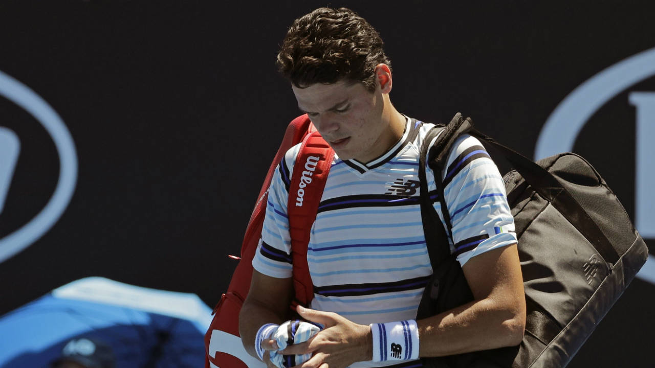Canada's-Milos-Raonic-leaves-the-court-following-his-first-round-loss-to-Slovakia's-Lukas-Lacko-at-the-Australian-Open-tennis-championships-in-Melbourne,-Australia,-Tuesday,-Jan.-16,-2018.-(Dita-Alangkara/AP)