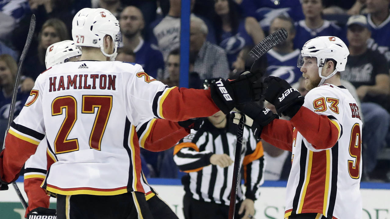 Calgary-Flames-centre-Sam-Bennett-(93)-celebrates-his-goal-against-the-Tampa-Bay-Lightning-with-defenceman-Dougie-Hamilton-(27)-during-the-second-period-of-an-NHL-hockey-game-Thursday,-Jan.-11,-2018,-in-Tampa,-Fla.-(Chris-O'Meara/AP)