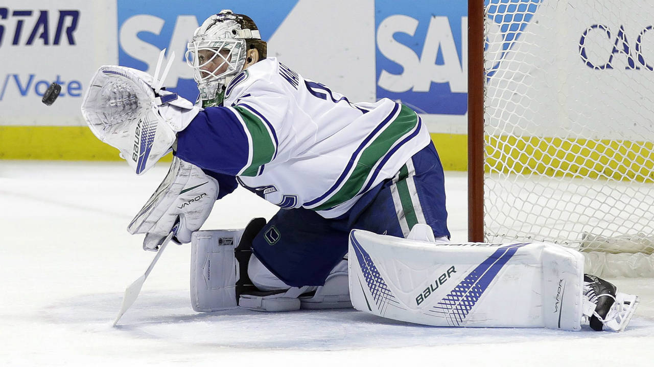 Vancouver-Canucks-goalie-Jacob-Markstrom-stops-a-shot-by-the-San-Jose-Sharks-during-the-first-period-of-an-NHL-hockey-game-Thursday,-Dec.-21,-2017,-in-San-Jose,-Calif.-(Marcio-Jose-Sanchez/AP)