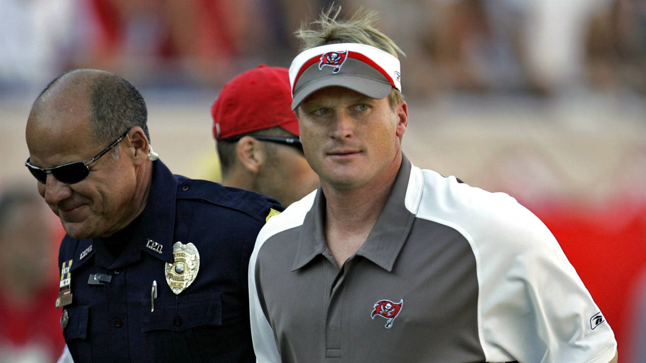 In-this-Sunday-Nov.-4,-2007-file-photo,-Tampa-Bay-Buccaneers-head-coach-Jon-Gruden,-right,-leaves-the-field-after-an-NFL-football-game-against-the-Arizona-Cardinals-in-Tampa,-Fla.-Jon-Gruden-says-he-hopes-he's-a-candidate-to-return-for-a-second-stint-as-coach-of-the-Oakland-Raiders-and-believes-a-final-decision-will-be-made-next-week.-Gruden-made-his-most-specific-comments-about-the-opening-in-Oakland-created-when-the-Raiders-fired-Jack-Del-Rio-following-a-disappointing-six-win-season-in-an-interview-Tuesday,-Jan.-2,-2018-with-the-Bay-Area-News-Group.-(Chris-O'Meara,-File/AP)
