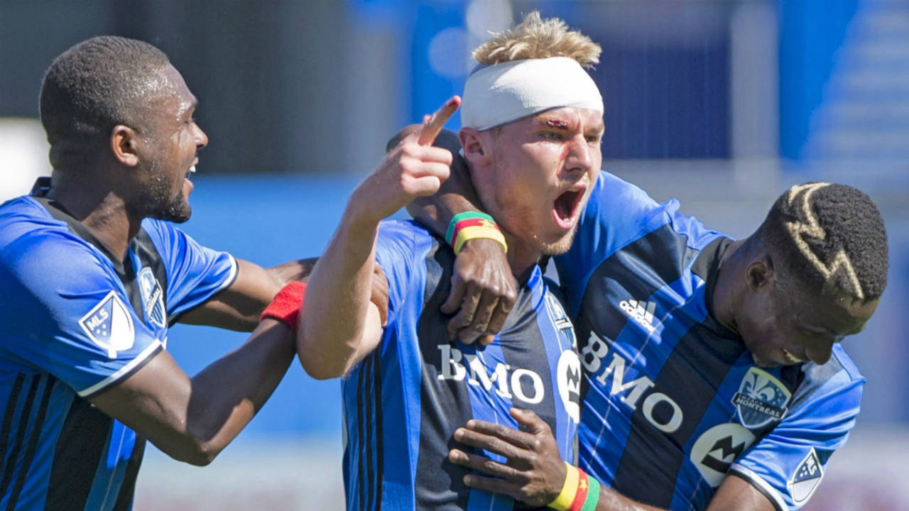 Montreal-Impact's-Kyle-Fisher,-centre.-(Graham-Hughes/CP)