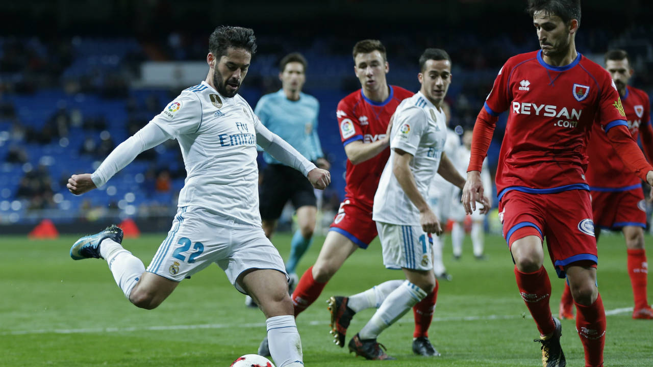 Real-Madrid's-Francisco-Roman-"Isco",-left,-shoots-the-ball-next-to-Numancia's-Unai-Elgezabal-during-the-Spanish-Copa-del-Rey-round-of-16-second-leg-soccer-match-between-Real-Madrid-and-Numancia-at-the-Santiago-Bernabeu-stadium-in-Madrid,-Wednesday,-Jan.-10,-2018.-Real-Madrid-won-5-2-on-aggregate.-(Francisco-Seco/AP)
