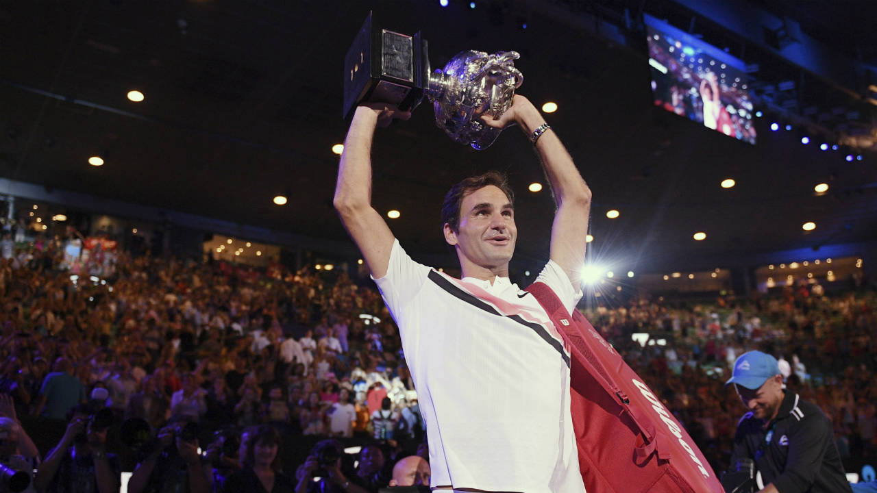 Switzerland's-Roger-Federer-holds-his-trophy-aloft-after-defeating-Croatia's-Marin-Cilic-in-the-men's-singles-final-at-the-Australian-Open-tennis-championships-in-Melbourne,-Australia,-Sunday,-Jan.-28,-2018.-(Andy-Brownbill/AP)