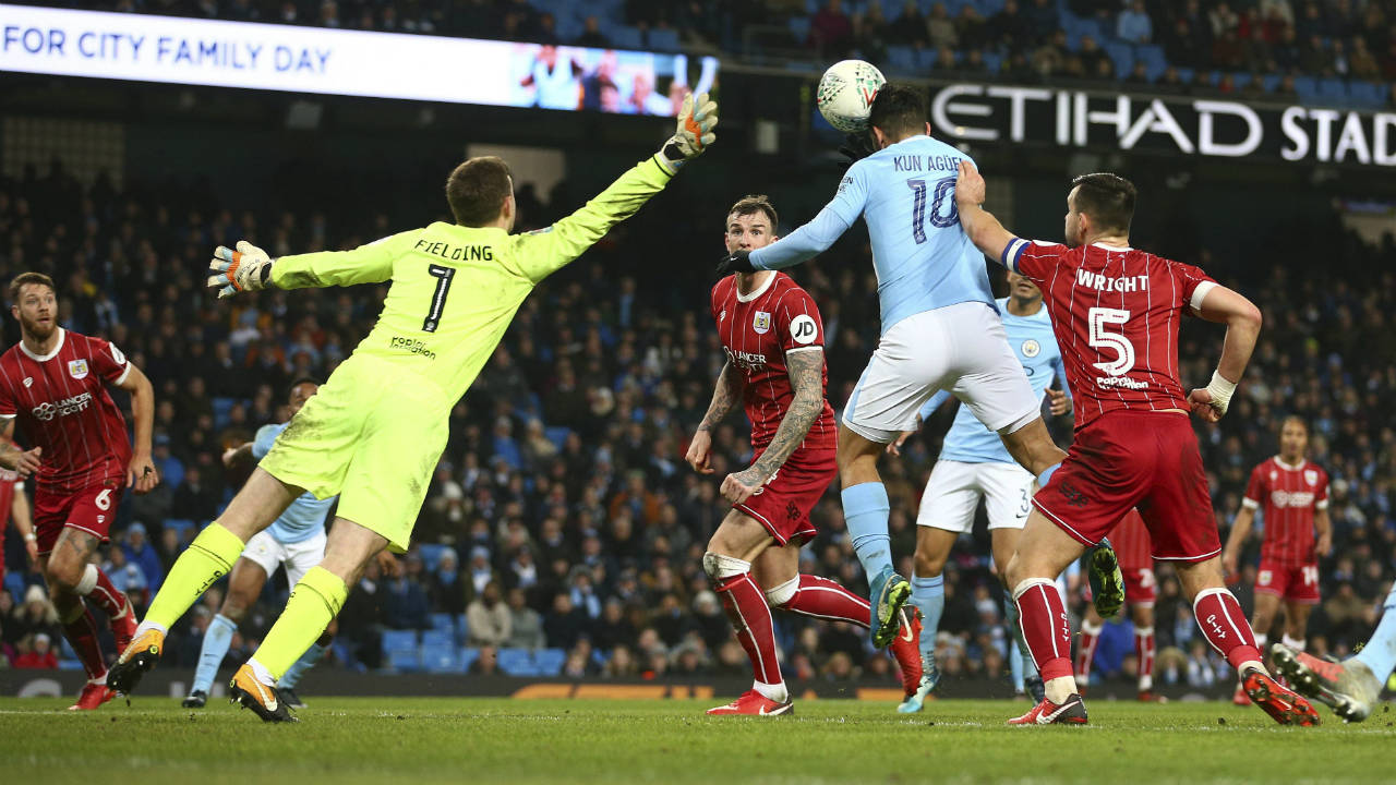 Manchester-City's-Sergio-Aguero-scores-his-sides-second-goal-during-the-English-League-Cup-semifinal-first-leg-soccer-match-between-Manchester-City-and-Bristol-City-at-the-Etihad-stadium-in-Manchester,-England,-Tuesday,-Jan.-9,-2018.-(Dave-Thompson/AP)