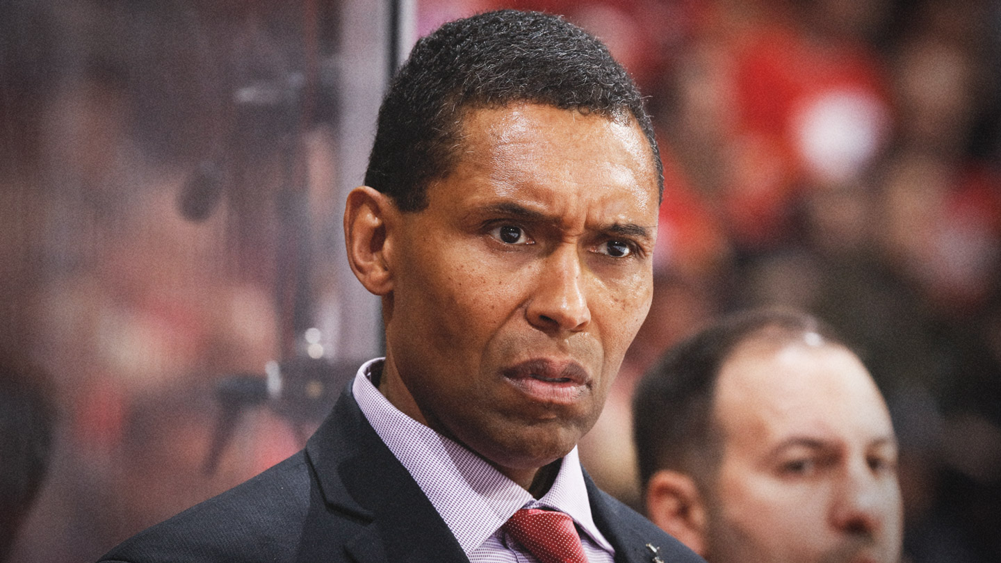 Calgary-Flames-assistant-coach-Paul-Jerrard-looks-on-during-a-game-against-the-St.-Louis-Blues-at-the-Scotiabank-Saddledome.