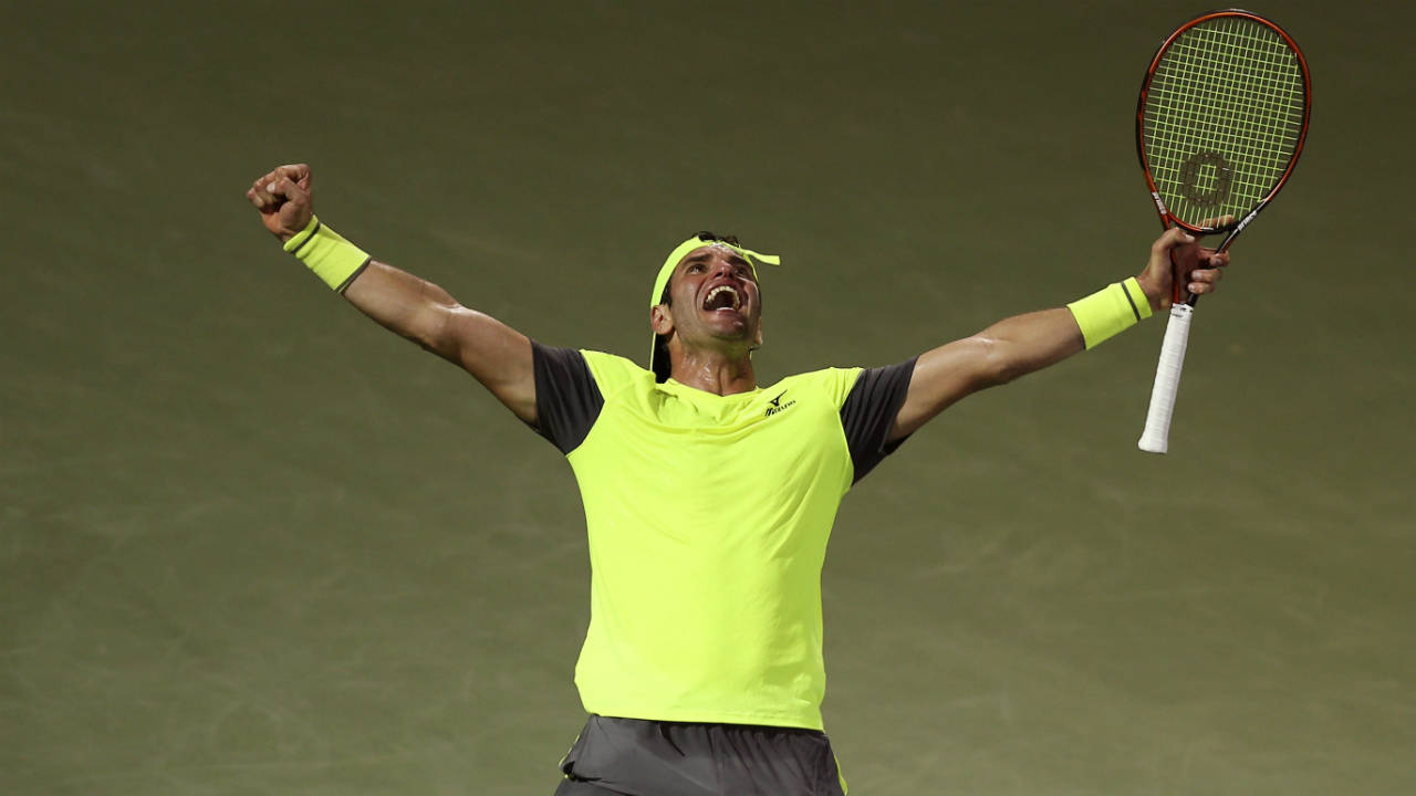 Malek-Jaziri-of-Tunisia-celebrates-after-winning-his-match-against-Grigor-Dimitrov-of-Bulgaria-during-the-Dubai-Duty-Free-Tennis-Championship-in-Dubai,-United-Arab-Emirates,-Tuesday,-Feb.-27,-2018.-(Kamran-Jebreili/AP)