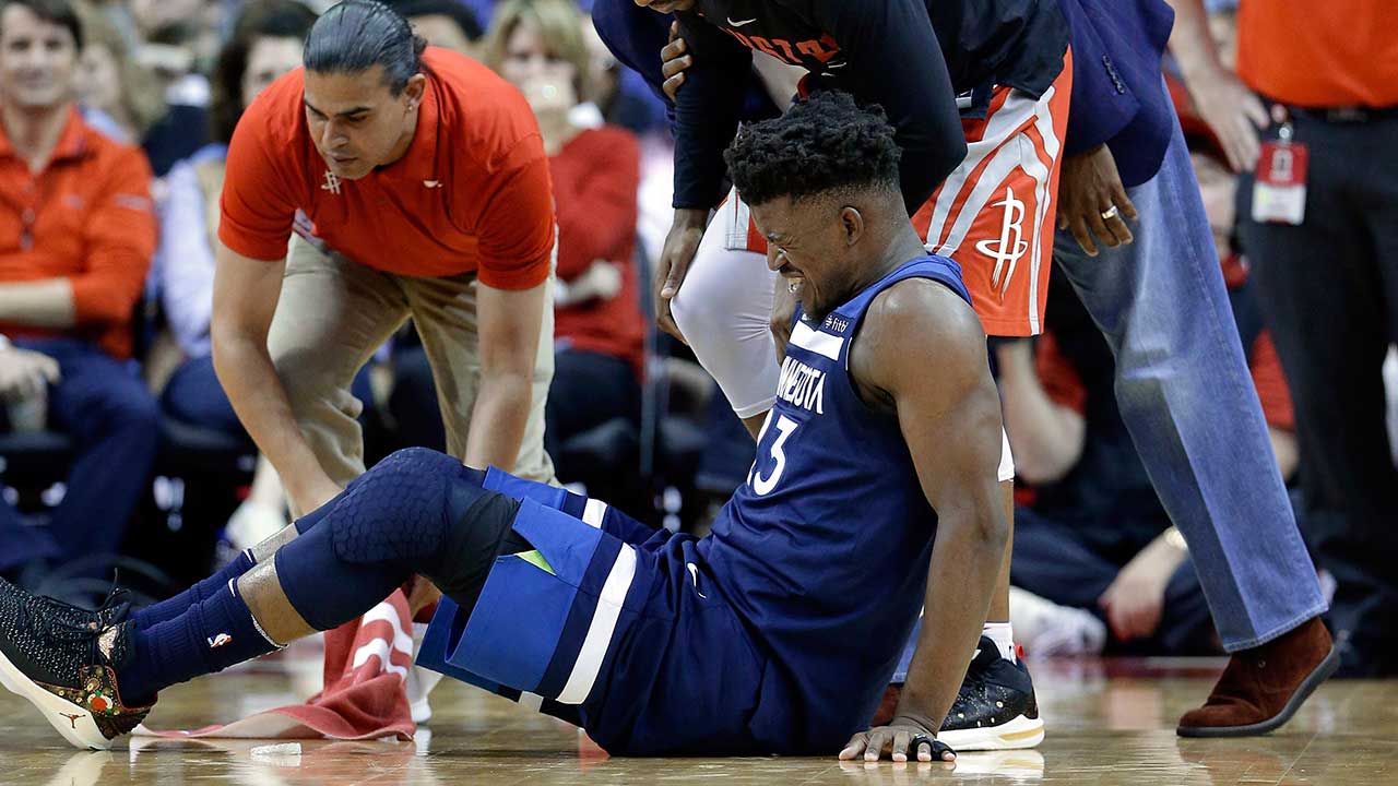 Minnesota-Timberwolves-guard-Jimmy-Butler-(23)-reacts-to-a-knee-injury