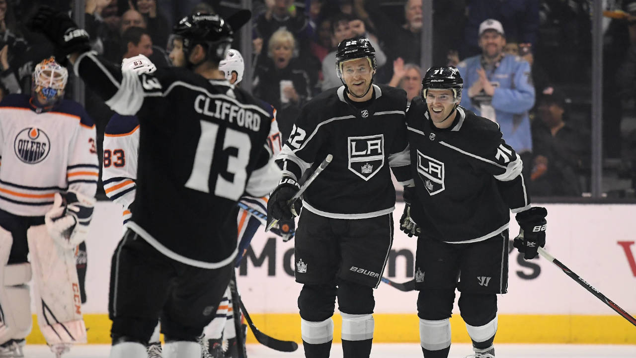 Los-Angeles-Kings-left-wing-Kyle-Clifford,-second-from-left,-celebrates-his-goal-along-with-center-Trevor-Lewis,-second-from-right,-and-center-Torrey-Mitchell-as-Edmonton-Oilers-goaltender-Cam-Talbot-watches-during-the-first-period-of-an-NHL-hockey-game,-Wednesday,-Feb.-7,-2018,-in-Los-Angeles.-(Mark-J.-Terrill/AP)