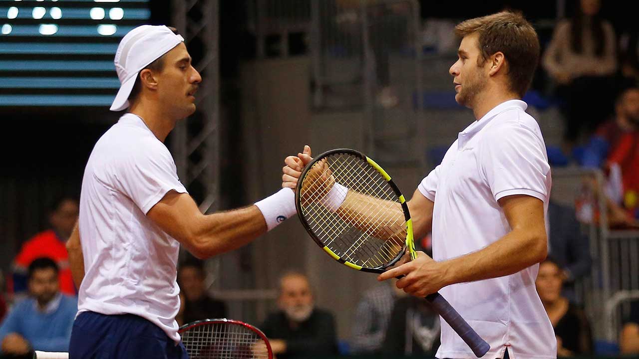 United-States'-Steve-Johnson,-left,-and-Ryan-Harrison-celebrate