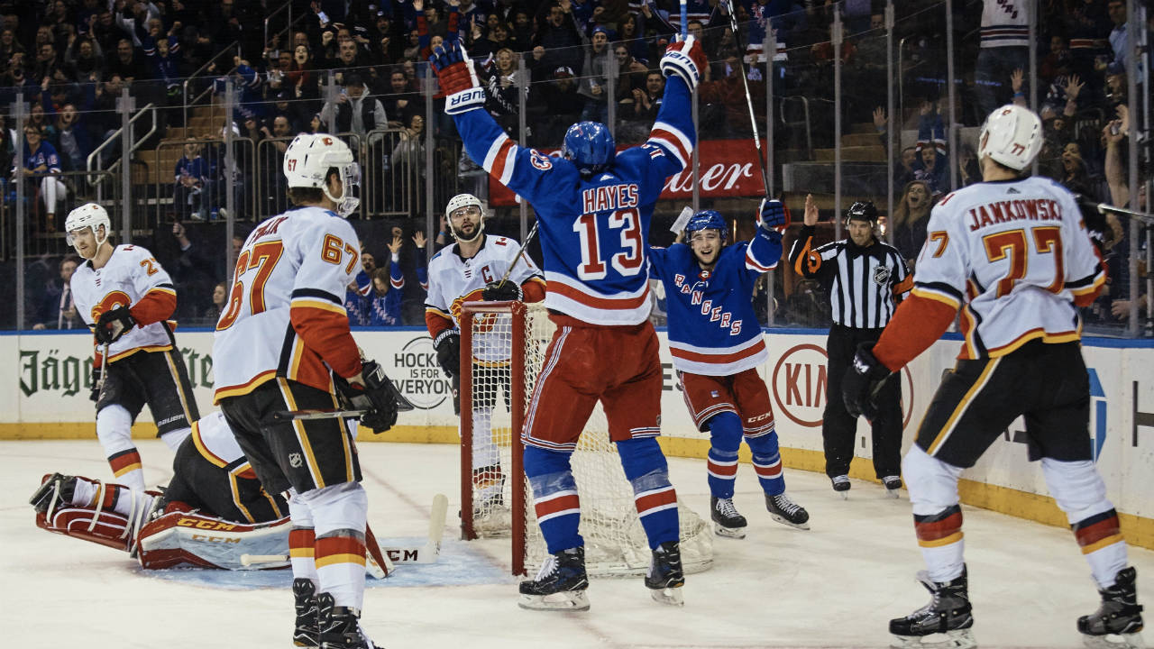 New-York-Rangers'-Kevin-Hayes,-centre,-celebrates-after-Michael-Grabner-scored-against-the-Calgary-Flames-during-the-second-period-of-an-NHL-hockey-game-Friday,-Feb.-9,-2018,-at-Madison-Square-Garden-in-New-York.-(Andres-Kudacki/AP)