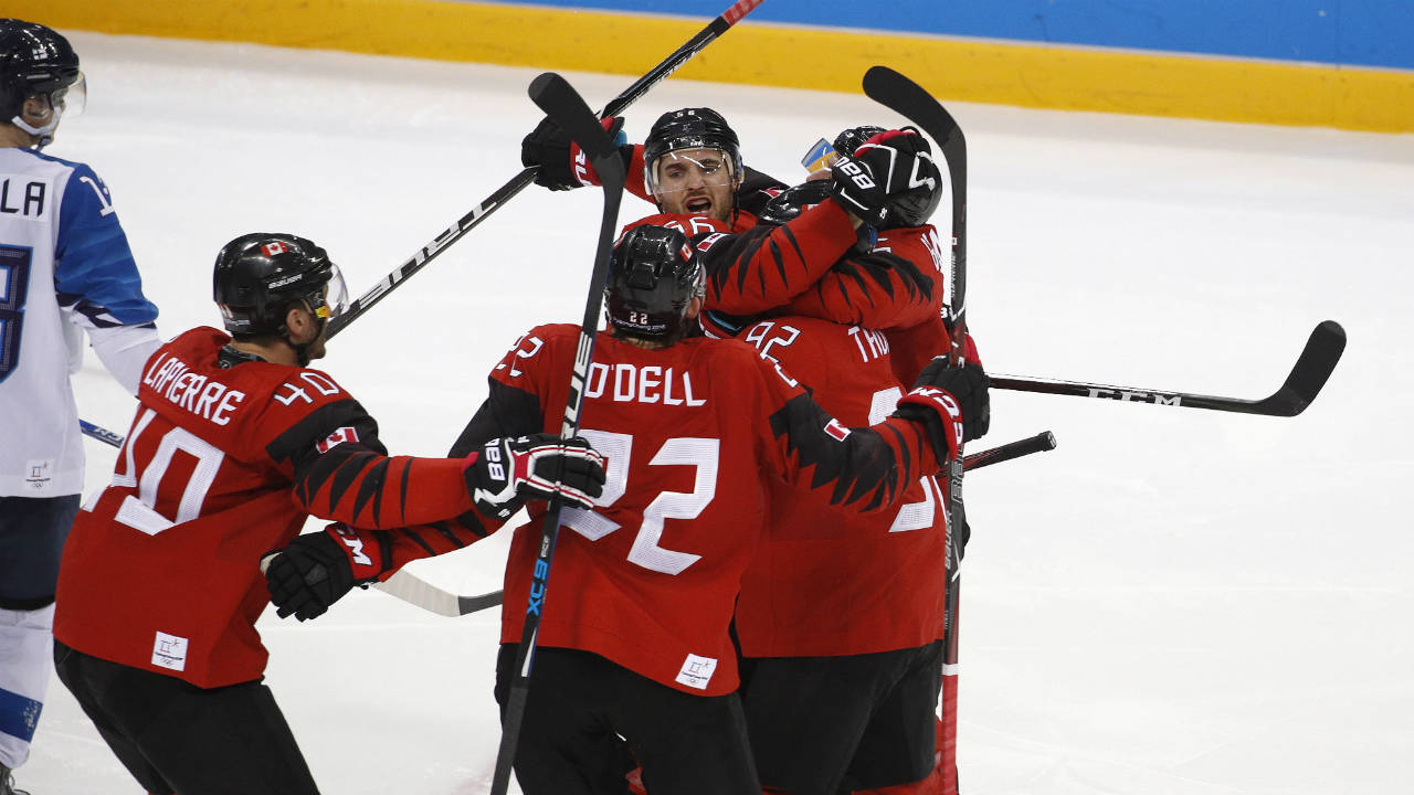 Maxim-Noreau-(56),-of-Canada,-celebrates-with-his-teammates-after-scoring-a-goal-against-Finland-during-the-third-period-of-the-quarterfinal-round-of-the-men's-hockey-game-at-the-2018-Winter-Olympics-in-Gangneung,-South-Korea,-Wednesday,-Feb.-21,-2018.-(Jae-C.-Hong/AP)