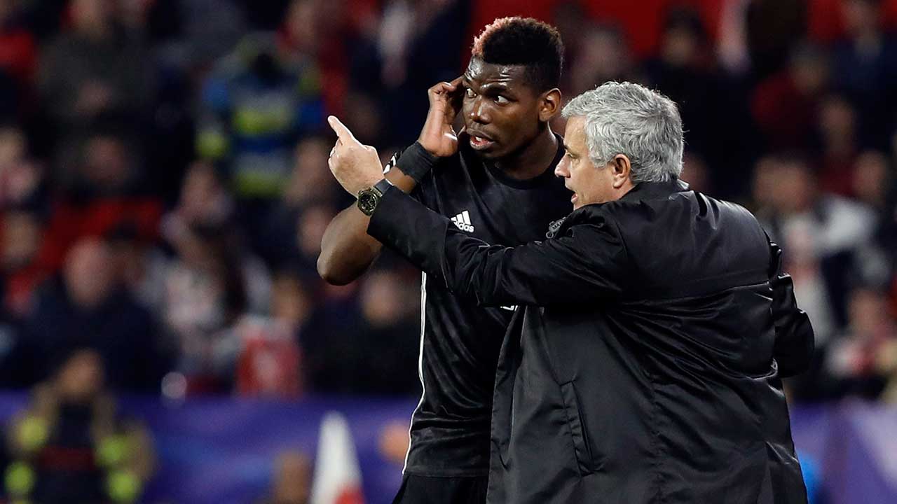 Jose-Mourinho,-right,-talks-to-Paul-Pogba