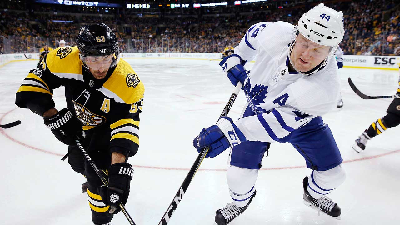 Toronto-Maple-Leafs'-Morgan-Rielly-and-Boston-Bruins'-Brad-Marchand