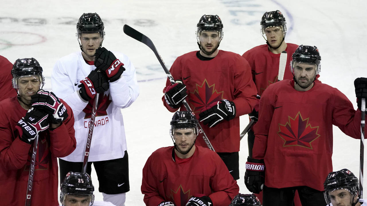 Members-of-Canada-men's-hockey-team-gather-on-the-ice-during-a-practice-session-ahead-of-the-2018-Winter-Olympics-in-Gangneung,-South-Korea,-Friday,-Feb.-9,-2018.-(Felipe-Dana/AP)