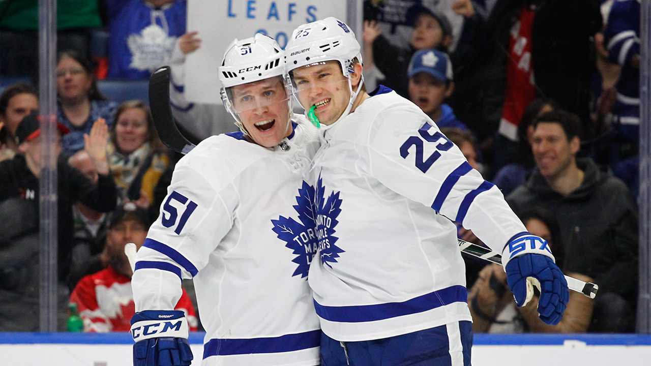 Toronto-Maple-Leafs-Jake-Gardiner-(51)-and-James-Van-Riemsdyk-(25)-celebrate-a-goal-during-the-first-period-of-an-NHL-hockey-game-against-the-Buffalo-Sabres