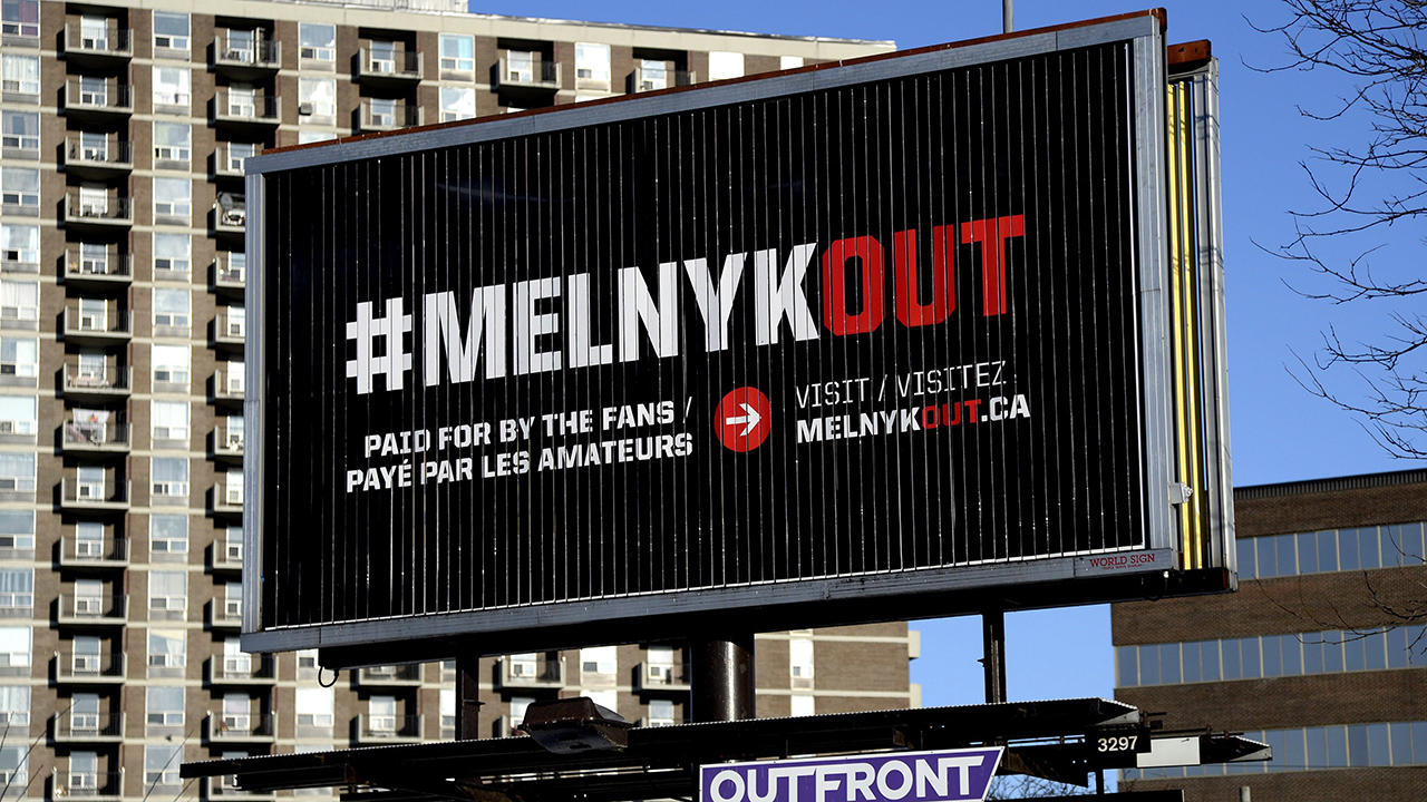 A-billboard-reading-#Melnykout,-calling-for-the-Ottawa-Senators-owner-to-sell-the-team