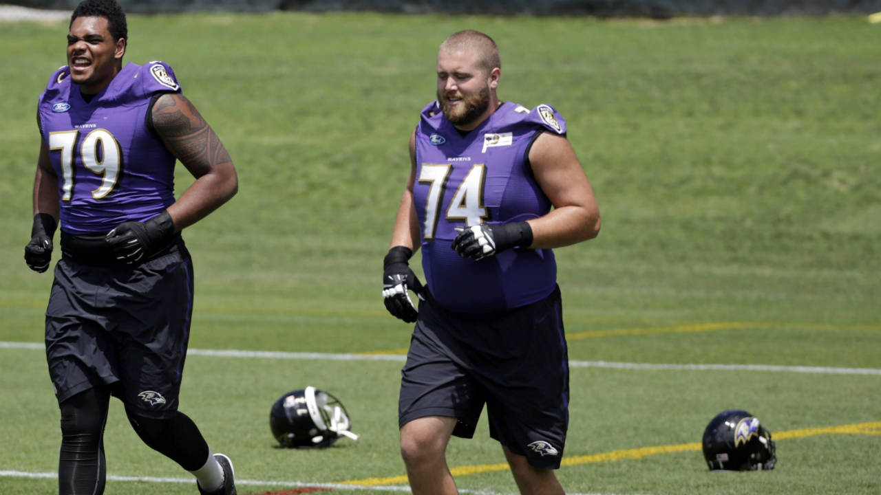 Baltimore-Ravens-tackle-Ronnie-Stanley,-left,-and-offensive-linebacker-James-Hurst-jog-on-the-field-during-an-NFL-football-practice-at-the-team's-practice-facility-in-Owings-Mills,-Md.,-Tuesday,-June-7,-2016.-(Patrick-Semansky/AP)
