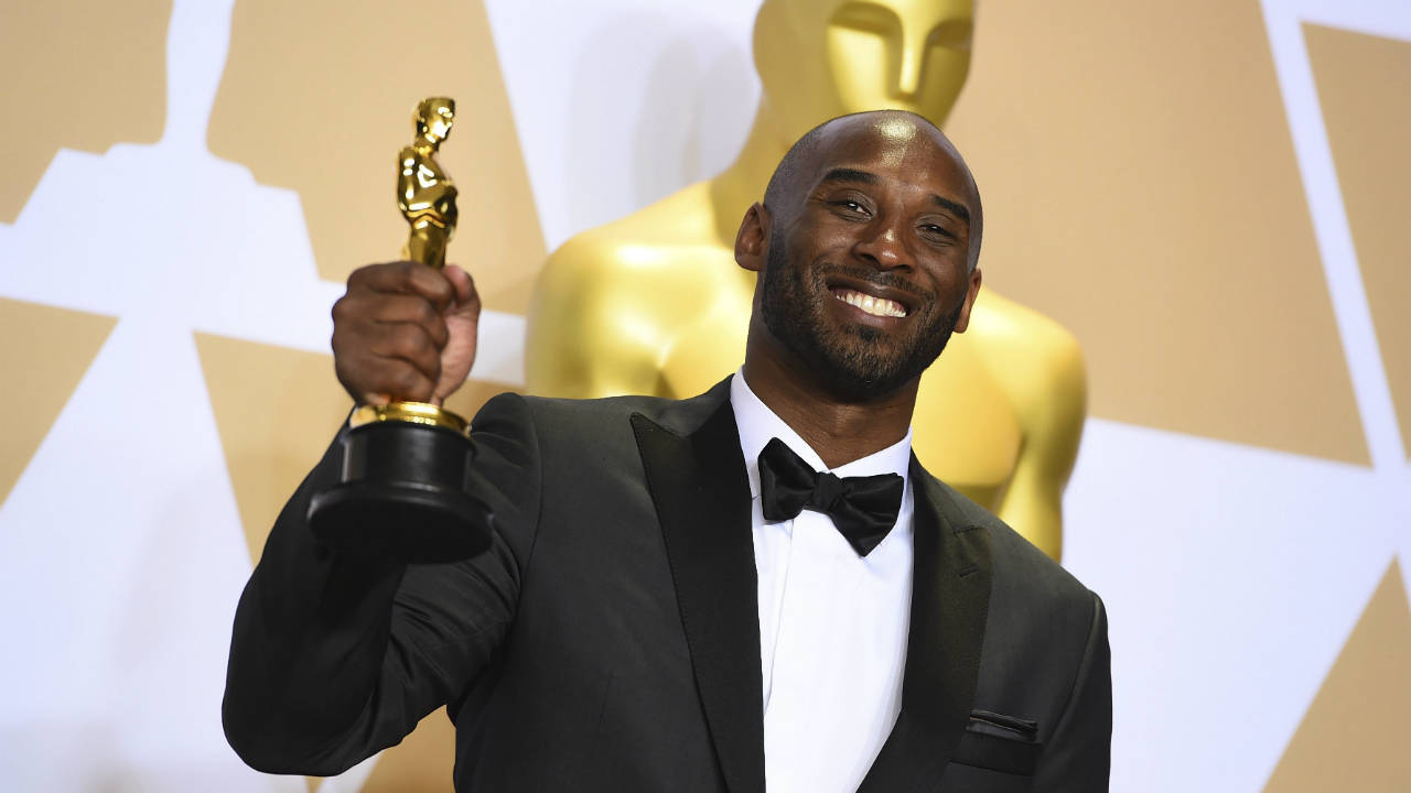 Kobe-Bryant,-winner-of-the-award-for-best-animated-short-for-"Dear-Basketball",-poses-in-the-press-room-at-the-Oscars-on-Sunday,-March-4,-2018,-at-the-Dolby-Theatre-in-Los-Angeles.-(Photo-by-Jordan-Strauss/Invision/AP)