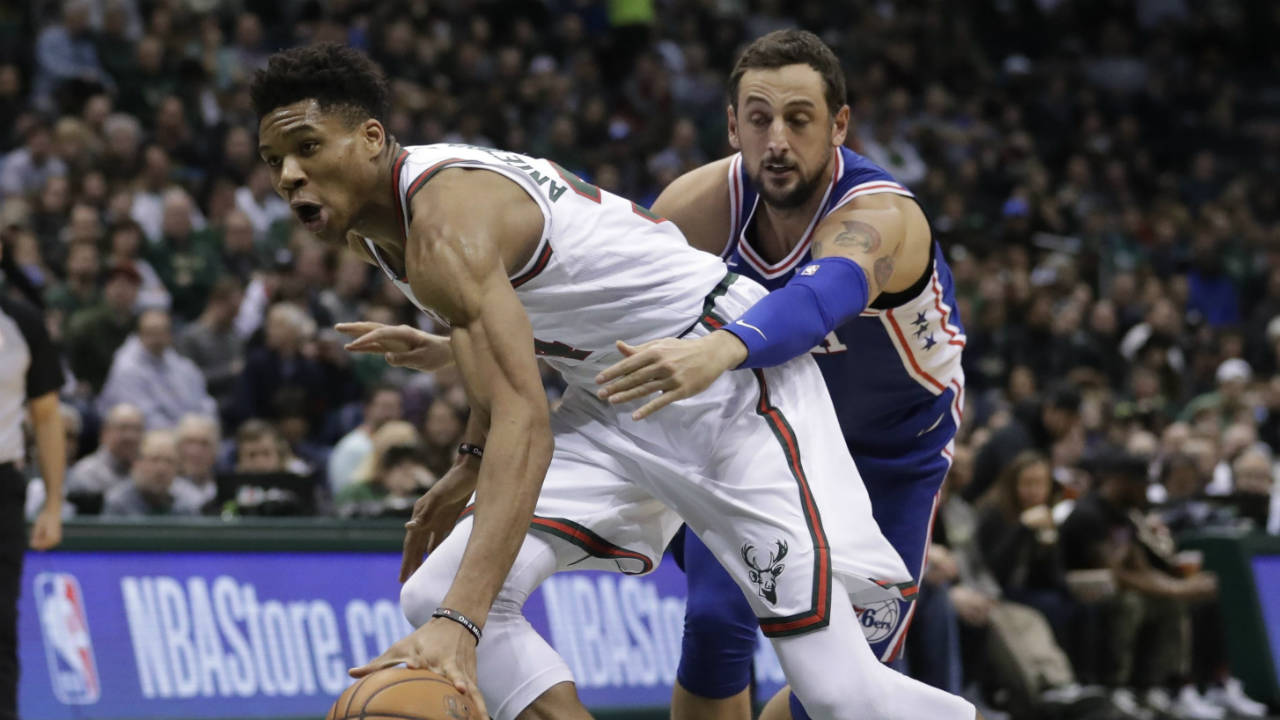 Milwaukee-Bucks'-Giannis-Antetokounmpo-drives-past-Philadelphia-76ers'-Marco-Belinelli-during-the-second-half-of-an-NBA-basketball-game-Sunday,-March-4,-2018,-in-Milwaukee.-The-Bucks-won-118.110.-(Morry-Gash/AP)