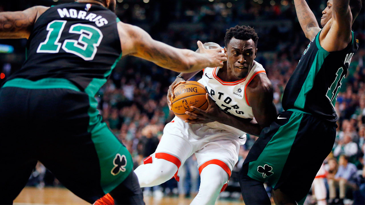Pascal-Siakam-of-the-Toronto-Raptors-drives-through-traffic-in-a-2018-game-against-the-Boston-Celtics.