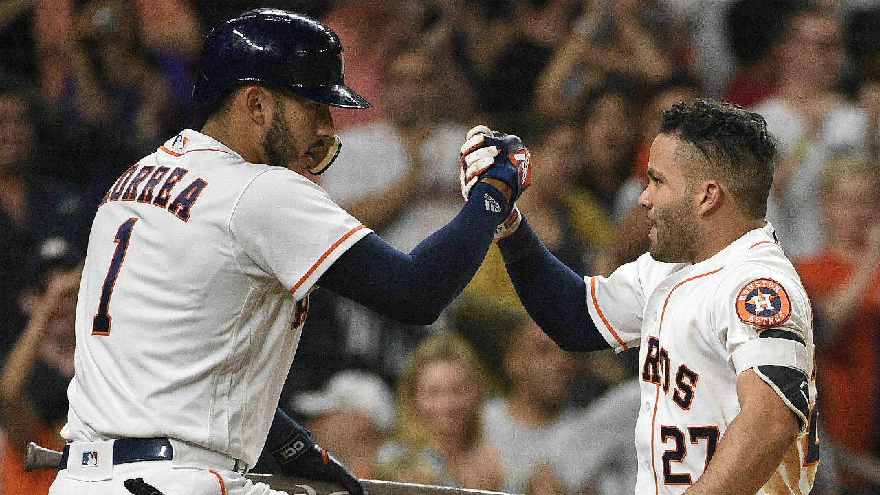 Houston-Astros'-Jose-Altuve,-right,-celebrates-his-solo-home-run-off-Oakland-Athletics-relief-pitcher-Wilmer-Font-with-Carlos-Correa-during-the-sixth-inning-of-a-baseball-game-Saturday,-April-28,-2018,-in-Houston.-(Eric-Christian-Smith/AP)