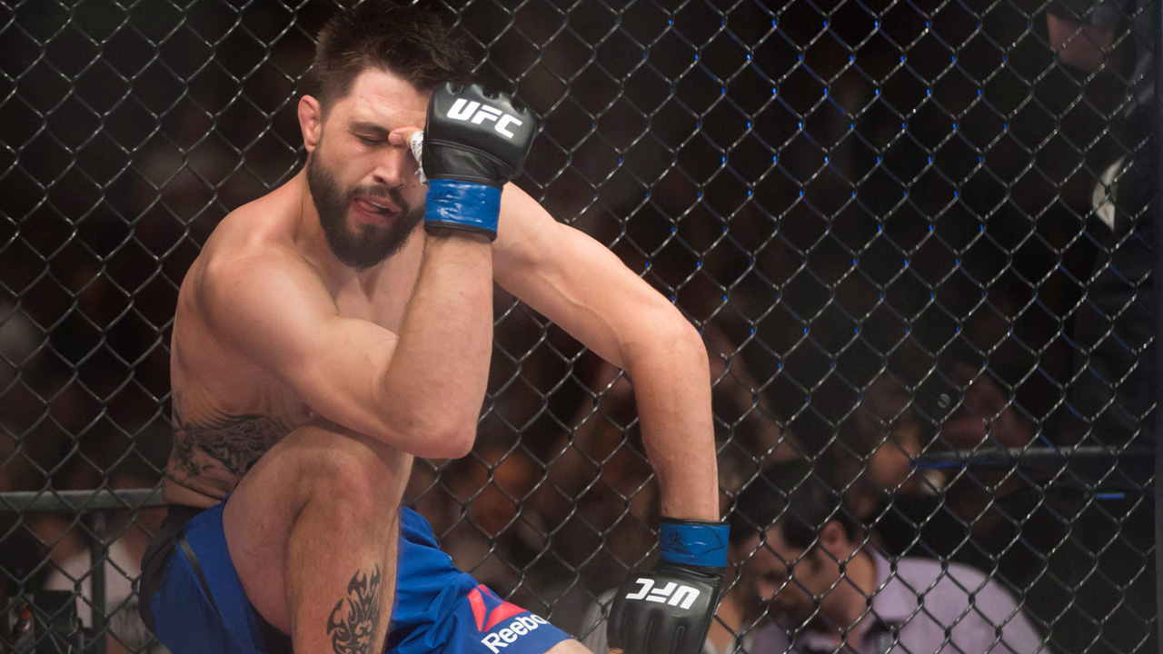 Carlos-Condit-welterweight-kneels-disappointed-after-losing-a-fight.