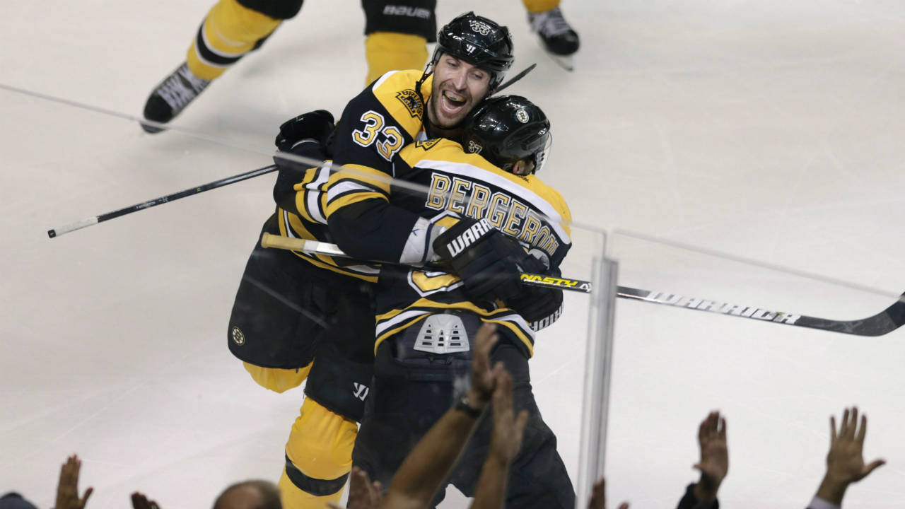 Boston-Bruins-centre-Patrice-Bergeron-(37)-is-embraced-by-teammate-Zdeno-Chara-(33)-after-scoring-the-game-winning-goal-off-Toronto-Maple-Leafs-goalie-James-Reimer-during-overtime-in-Game-7-of-their-NHL-hockey-Stanley-Cup-playoff-series-in-Boston,-Monday,-May-13,-2013.-The-Bruins-won-5-4.-Mitch-Marner-had-just-turned-16-when-the-Toronto-Maple-Leafs-and-Boston-Bruins-tangled-in-Game-7-of-their-2013-first-round-playoff-series.-(Charles-Krupa/AP)