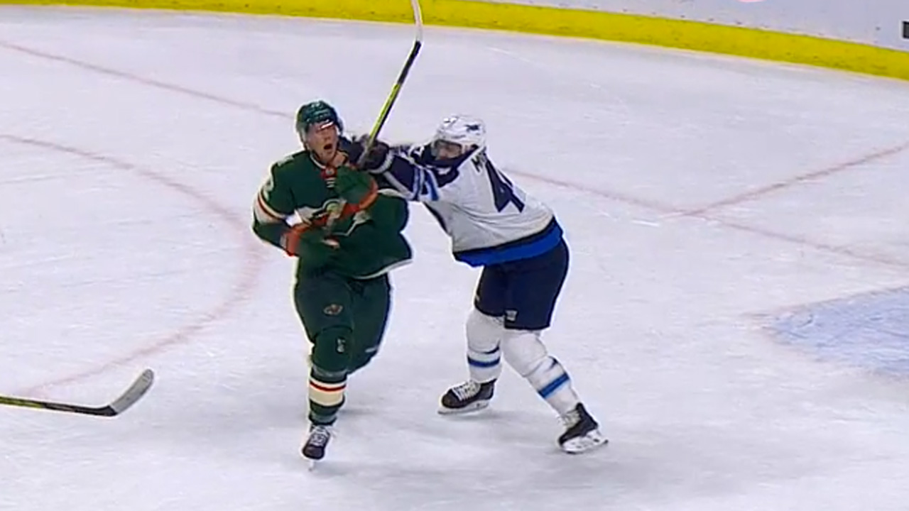 Winnipeg-Jets-defenceman-Joshua-Morrissey-gets-away-with-a-cross-check-to-the-face-of-Minnesota-Wild-forward-Eric-Staal.