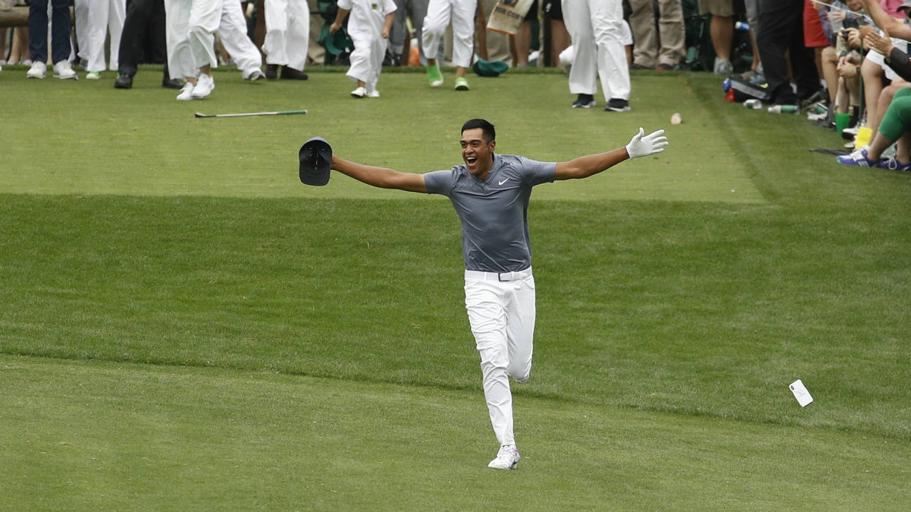 Tony-Finau-reacts-after-hitting-a-hole-in-one-on-the-seventh-home-during-the-par-three-competition-at-the-Masters-golf-tournament-Wednesday,-April-4,-2018,-in-Augusta,-Ga.-(Charlie-Riedel/AP)