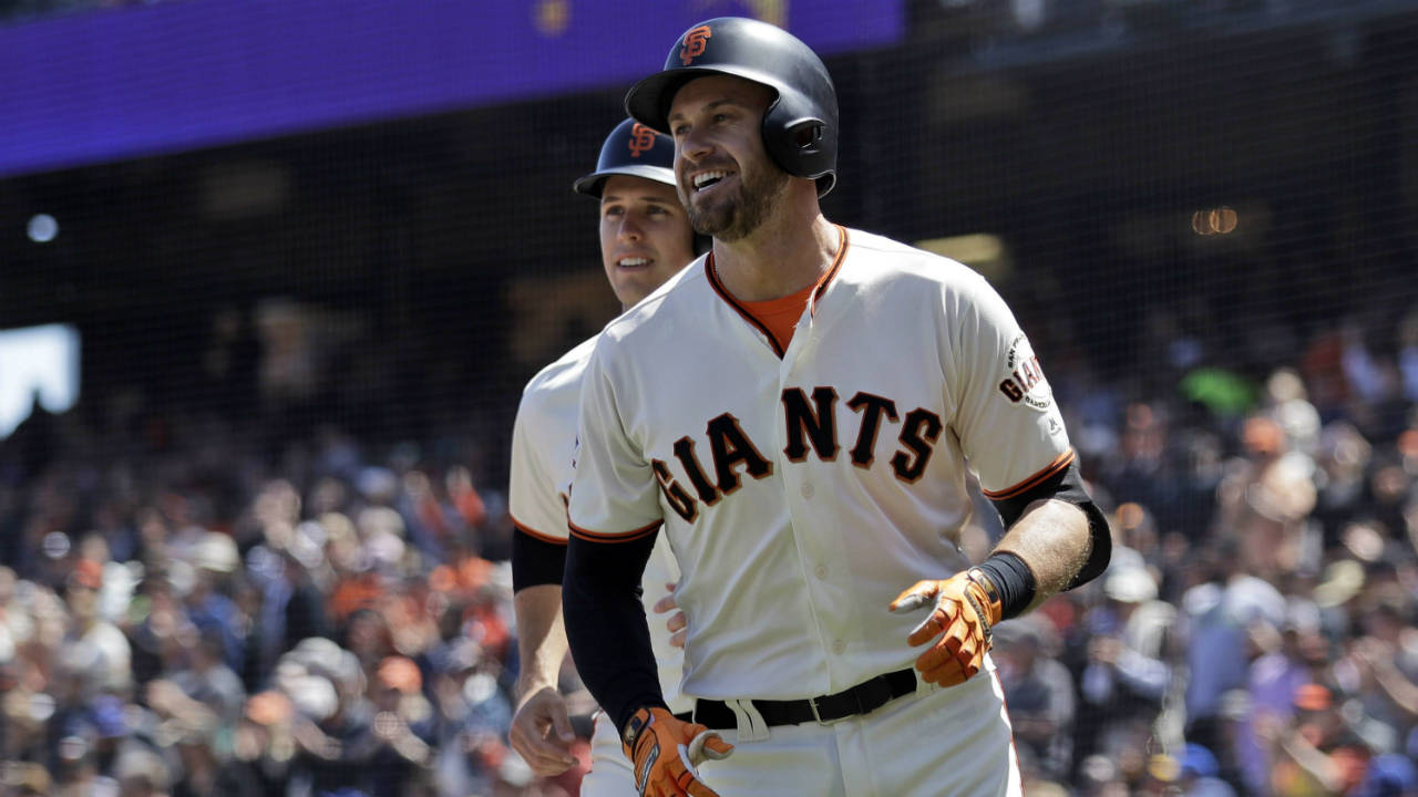 San-Francisco-Giants'-Evan-Longoria,-right,-smiles-in-front-of-teammate-Buster-Posey-after-Longoria's-three-run-home-run-during-the-first-inning-of-a-baseball-game-against-the-Los-Angeles-Dodgers-Sunday,-April-29,-2018,-in-San-Francisco.-(Marcio-Jose-Sanchez/AP)