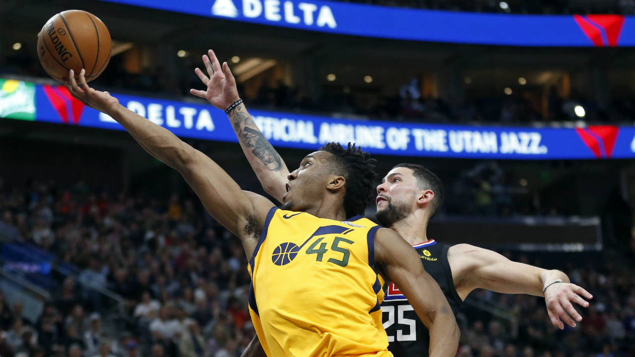 Utah-Jazz-guard-Donovan-Mitchell-(45)-goes-to-the-basket-as-Los-Angeles-Clippers-guard-Austin-Rivers-(25)-defends-in-the-second-half-during-an-NBA-basketball-game-Thursday,-April-5,-2018,-in-Salt-Lake-City.-(Rick-Bowmer/AP)