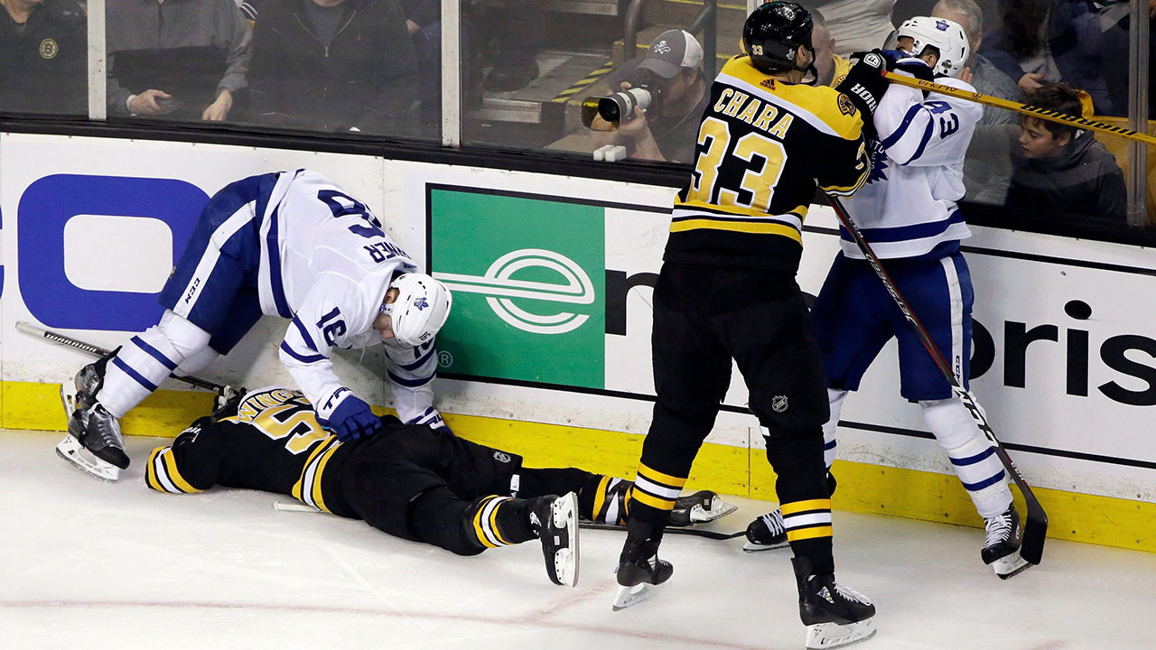 Boston-Bruins-defenceman-Zdeno-Chara-shoves-Toronto-Maple-Leafs-centre-Nazem-Kadri-to-retaliate-for-Kadri's-late-hit-on-Boston-Bruins-forward-Tommy-Wingels-as-Maple-Leafs'-Mitchell-Marner-(16)-starts-to-get-up-off-the-ice.