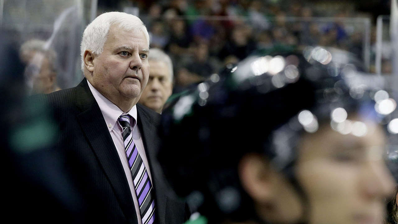 Dallas-Stars-head-coach-Ken-Hitchcock-looks-on-from-the-bench-during-the-first-period-of-a-preseason-NHL-hockey-game-against-the-Minnesota-Wild-in-Dallas