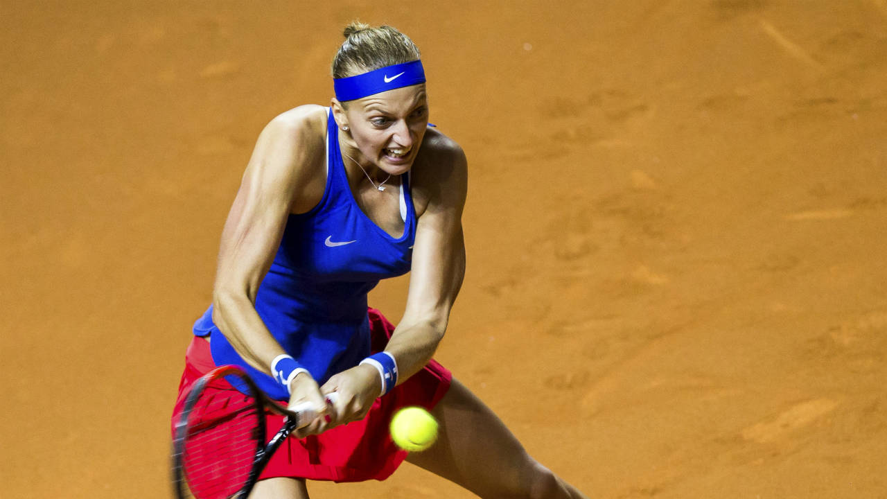 Czech-Republic's-Petra-Kvitova-returns-a-shot-to-Julia-Goerges-during-the-tennis-Fed-Cup-semifinal-between-Germany-and-Czech-Republic-in-Stuttgart,-Germany,-Saturday,-April-21,-2018.-(Thomas-Niedermueller/dpa-via-AP)