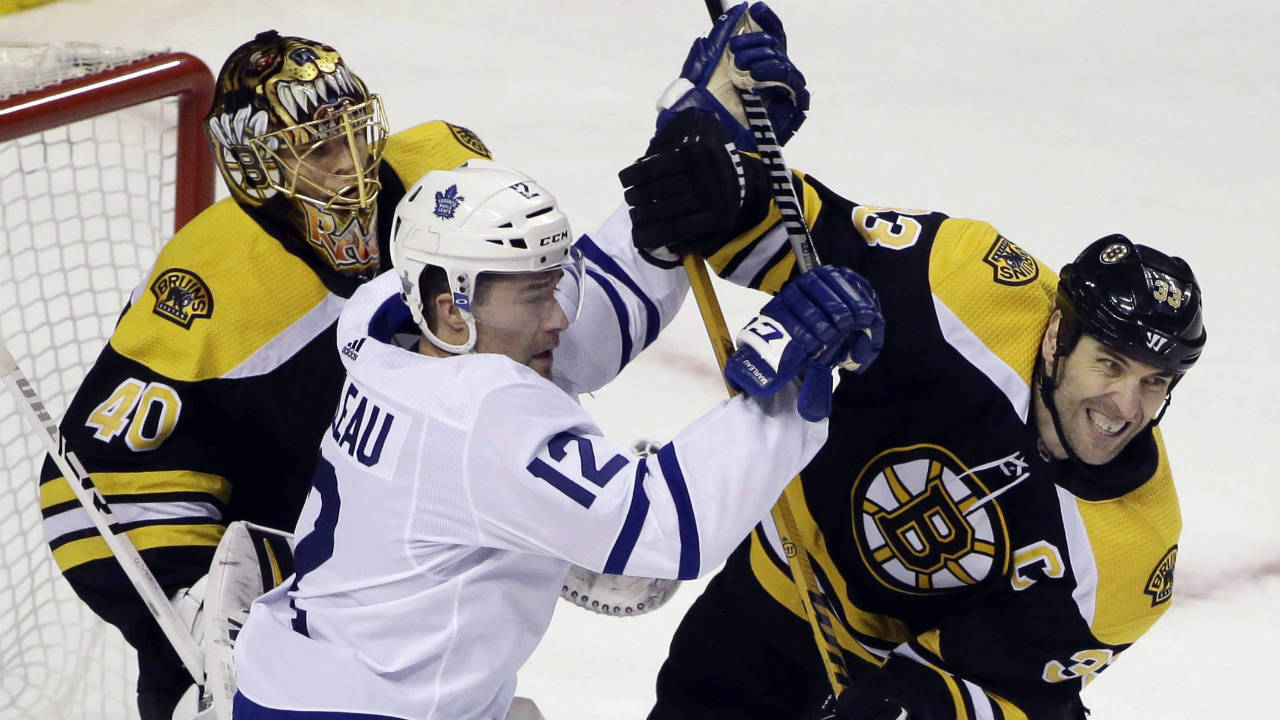 Toronto-Maple-Leafs-centre-Patrick-Marleau-(12)-struggles-for-position-against-Boston-Bruins-defenceman-Zdeno-Chara-(33)-in-front-of-Bruins-goaltender-Tuukka-Rask-(40)-during-the-first-period-of-Game-1-of-an-NHL-hockey-first-round-playoff-series-Thursday,-April-12,-2018,-in-Boston.-(Elise-Amendola/AP)