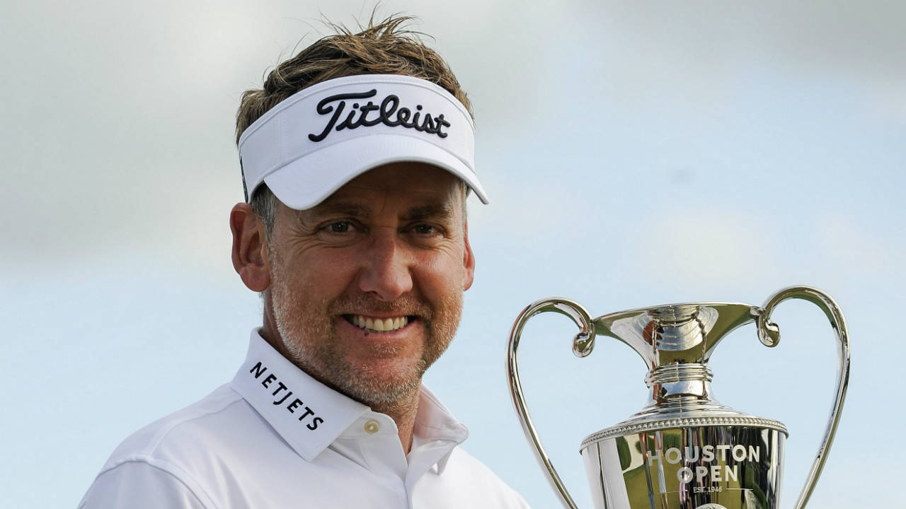 Ian-Poulter-holds-the-trophy-after-winning-the-Houston-Open-golf-tournament-on-the-first-hole-of-a-playoff-against-Beau-Hossler,-Sunday,-April-1,-2018,-in-Humble,-Texas.-(Eric-Christian-Smith/AP)
