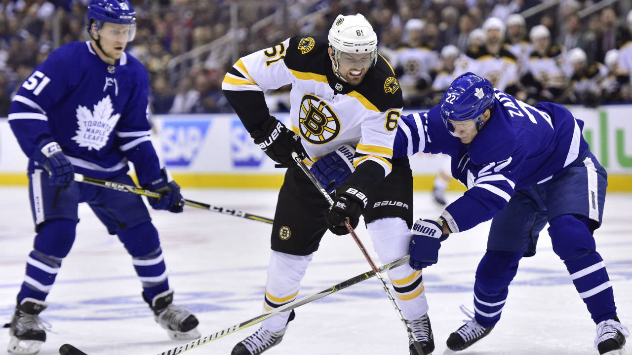 Boston-Bruins-left-wing-Rick-Nash-(61)-and-Toronto-Maple-Leafs-defenceman-Nikita-Zaitsev-(22)-battle-for-the-puck-during-first-period-NHL-round-one-playoff-hockey-action-in-Toronto-on-Monday,-April-23,-2018.-(Frank-Gunn/CP)