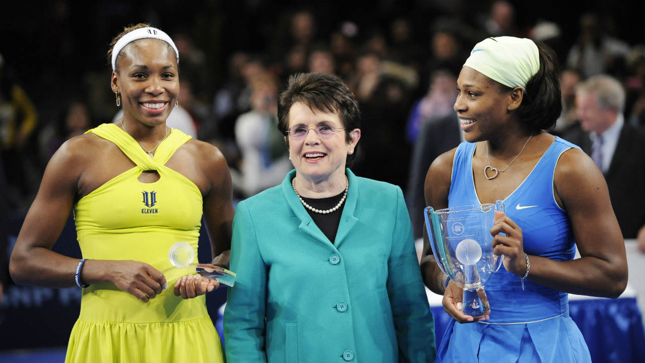 In-this-March-2,-2009,-file-photo,-Billie-Jean-King-is-flanked-by-Venus,-left,-and-Serena-Williams-after-Serena-defeated-Venus-in-the-championship-match-of-the-Billie-Jean-King-Cup-tennis-exhibition,-at-Madison-Square-Garden-in-New-York.-Venus-and-Serena-Williams-are-adding-their-names-and-voices-to-the-push-for-equal-pay-championed-by-the-Billie-Jean-King-Leadership-Initiative.-The-two-current-tennis-stars-are-joining-the-advisory-board-of-the-group-founded-by-the-former-player.-(Stephen-Chernin,-File/AP)
