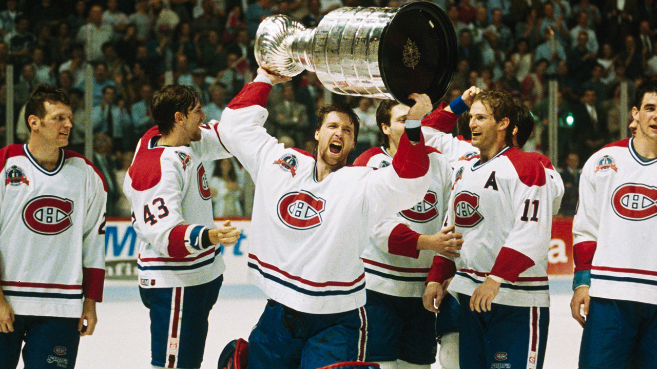 Montreal-Canadiens-goaltender-Patrick-Roy-raises-the-Stanley-Cup-in-1993.