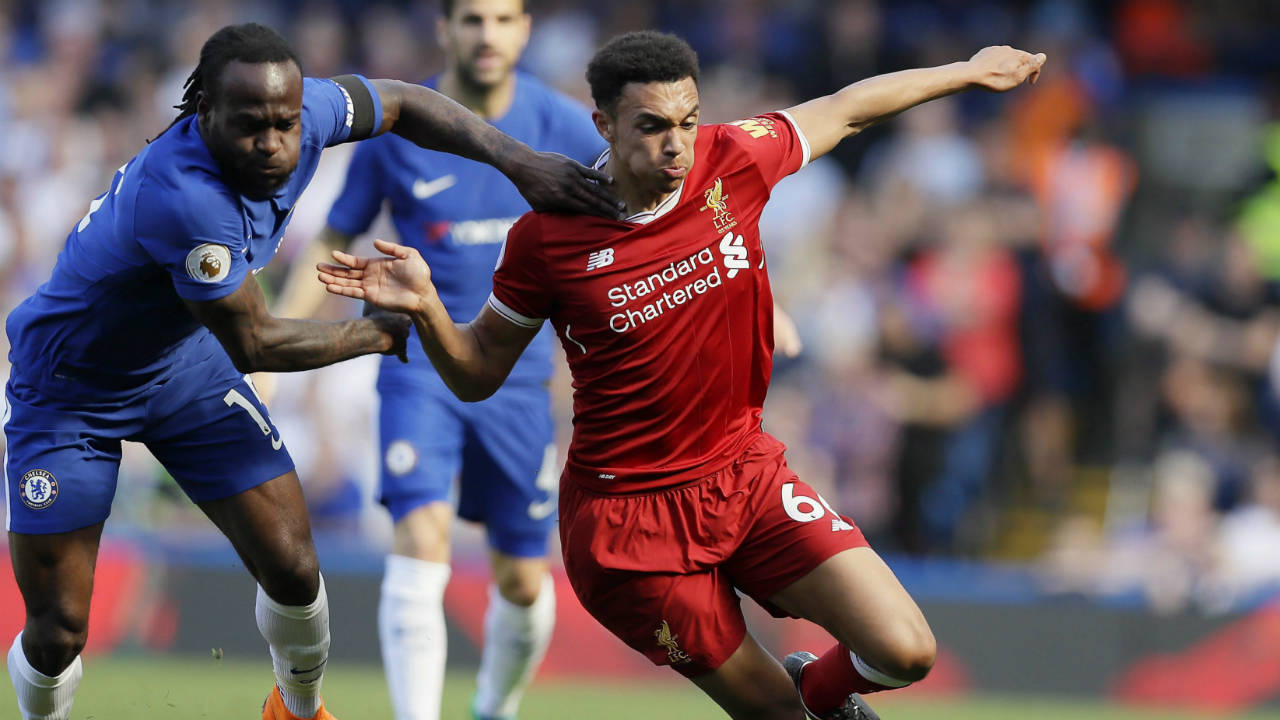 Chelsea's-Victor-Moses,-left,-challenges-for-the-ball-with-Liverpool's-Trent-Alexander-Arnold-during-the-English-Premier-League-soccer-match-between-Chelsea-and-Liverpool-at-Stamford-Bridge-stadium-in-London,-Sunday,-May-6,-2018.-(Kirsty-Wigglesworth/AP)