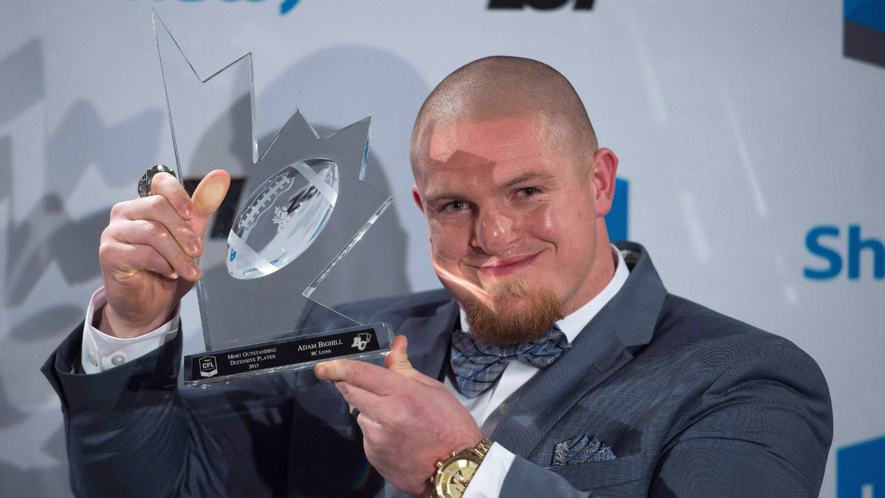 Adam-Bighill-poses-after-winning-the-CFL's-most-outstanding-defensive-player-award-during-the-Canadian-Football-League-awards-in-Winnipeg-on-Thursday-November-26,-2015.-(Jonathan-Hayward/CP)