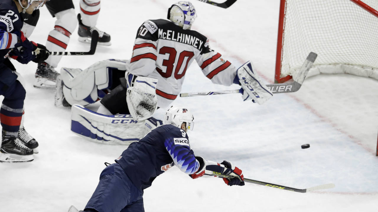 Nick-Bonino-of-the-United-States,-bottom,-scores-his-side's-second-goal-during-the-Ice-Hockey-World-Championships-bronze-medal-match-between-Canada-and-the-United-States-at-the-Royal-arena-in-Copenhagen,-Denmark,-Sunday,-May-20,-2018.-(Petr-David-Josek/AP)