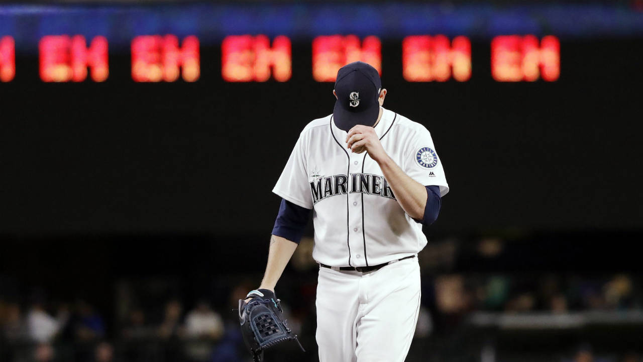 Seattle-Mariners-starting-pitcher-James-Paxton-gets-ready-for-the-next-batter-after-striking-out-an-Oakland-Athletics-player-as-a-line-of-"eh's,"-a-nod-to-Paxton's-Canadian-heritage-and-his-strikeout-count,-appears-on-a-scoreboard-during-the-seventh-inning-of-a-baseball-game-Wednesday,-May-2,-2018,-in-Seattle.-(Elaine-Thompson/AP)