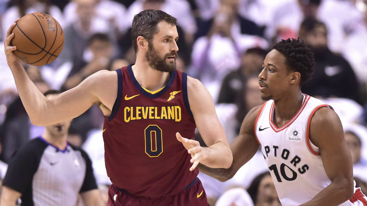 Cleveland-Cavaliers-centre-Kevin-Love-(0)-controls-the-ball-as-Toronto-Raptors-guard-DeMar-DeRozan-(10)-defends-during-first-half-NBA-playoff-basketball-action-in-Toronto-on-Thursday,-May-3,-2018.-(Frank-Gunn/CP)
