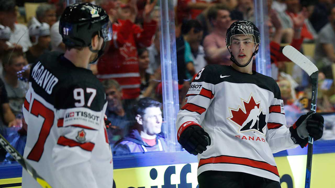 Canada's-Ryan-Nugent-Hopkins,-right,-celebrates-with-Connor-McDavid,-left