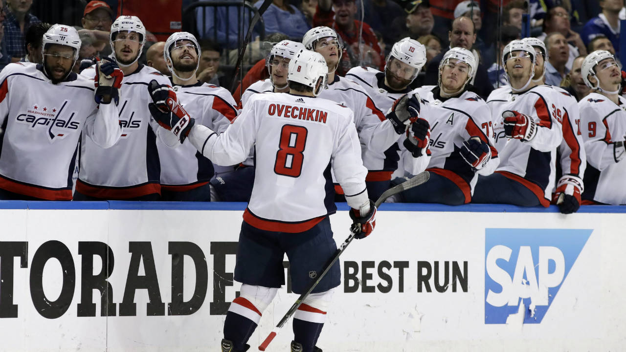 Washington-Capitals-left-wing-Alex-Ovechkin-(8)-celebrates-with-the-bench-after-scoring-against-the-Tampa-Bay-Lightning-during-the-third-period-of-Game-2-of-the-NHL-Eastern-Conference-finals-hockey-playoff-series-Sunday,-May-13,-2018,-in-Tampa,-Fla.-The-Capitals-won-the-game-6-2.-(Chris-O'Meara/AP)