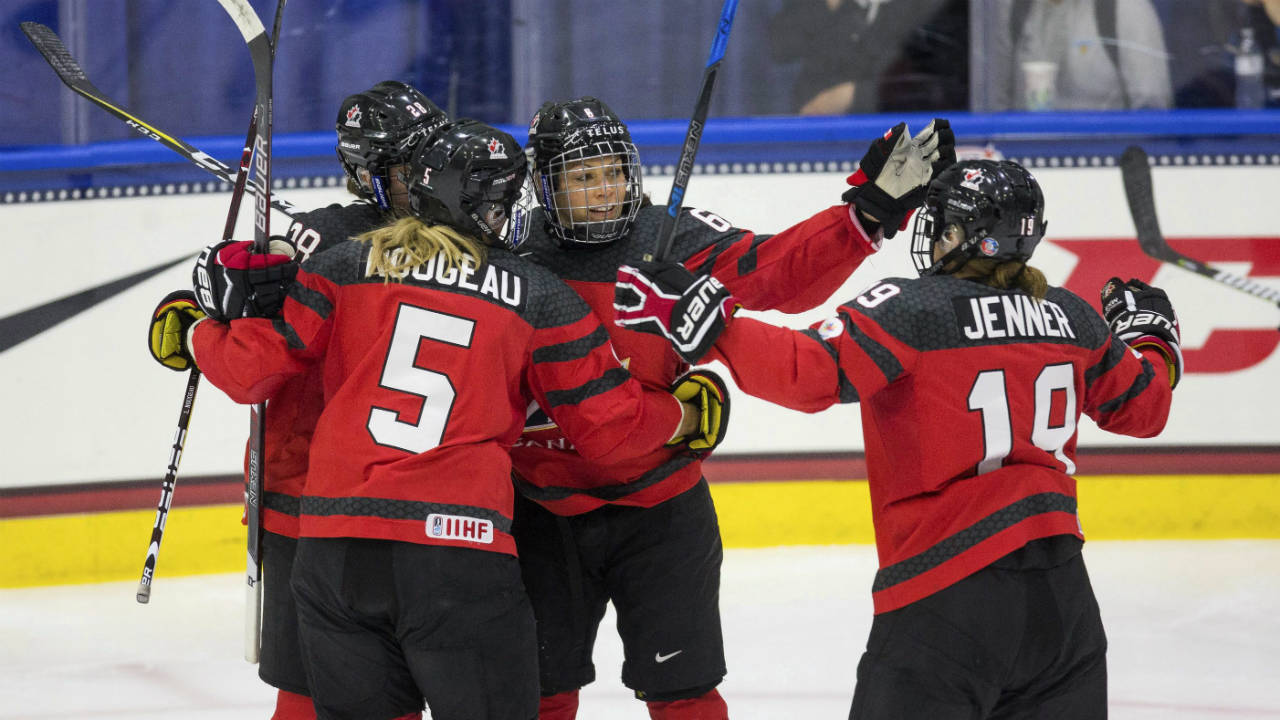 Canada's-Rebecca-Johnston-is-congratulated-by-teammates.-(Loren-Elliott/Tampa-Bay-Times-via-AP)