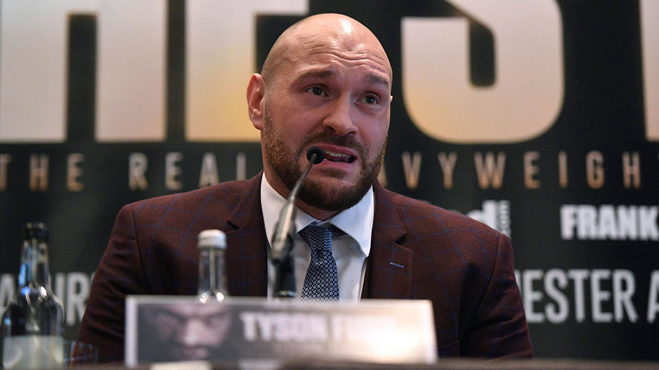 Former-world-heavyweight-boxing-champion-Tyson-Fury-seen-here-in-London,-England-in-April-2018-speaking-during-a-press-conference-to-announce-his-return-to-the-ring-.-Fury-is-returning-to-the-ring-after-serving-a-doping-ban.