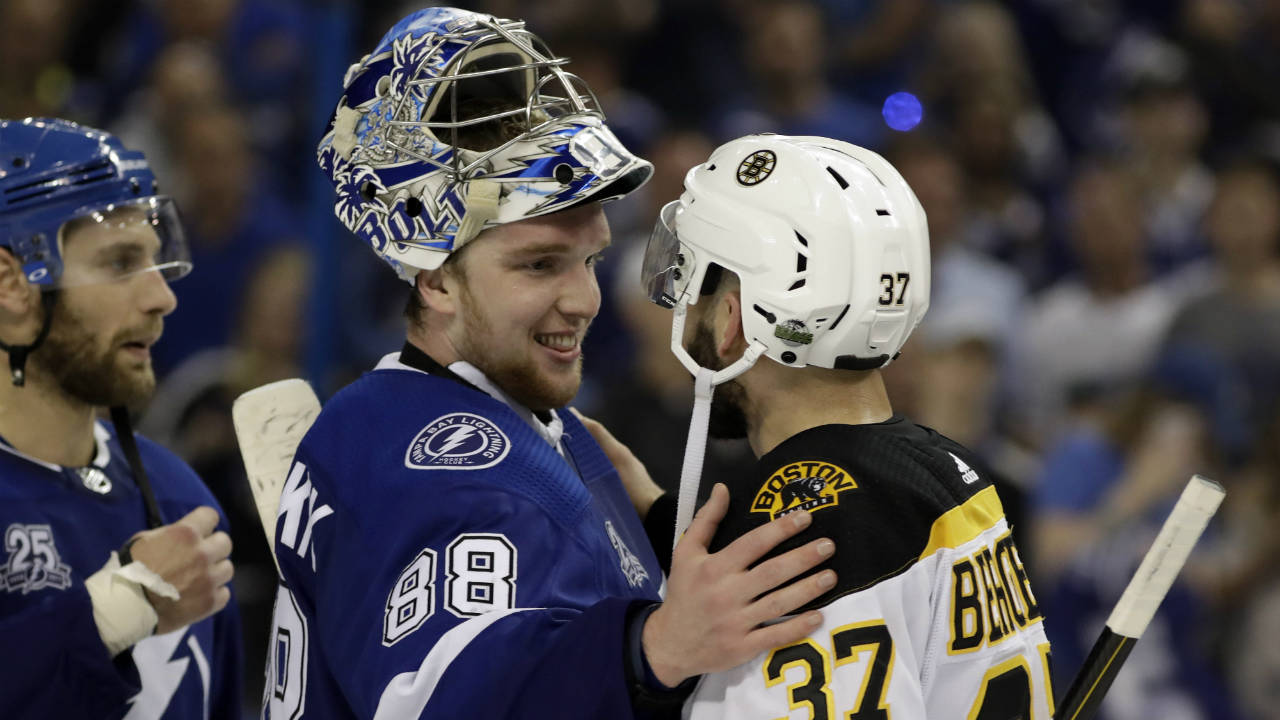 Tampa-Bay-Lightning-goaltender-Andrei-Vasilevskiy-(88)-pats-Boston-Bruins-centre-Patrice-Bergeron-(37)-after-Game-5-of-an-NHL-second-round-hockey-playoff-series-Sunday,-May-6,-2018,-in-Tampa,-Fla.