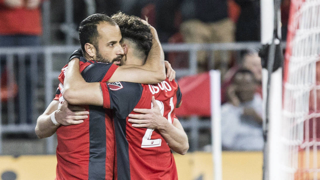 Toronto-FC-midfielder-Victor-Vazquez-(left)-celebrates-with-Jonathan-Osorio-after-scoring-his-team's-opening-goal-against-Philadelphia-Union-during-first-half-MLS-action-in-Toronto-on-Friday-May-4,-2018.-(Chris-Young/CP)
